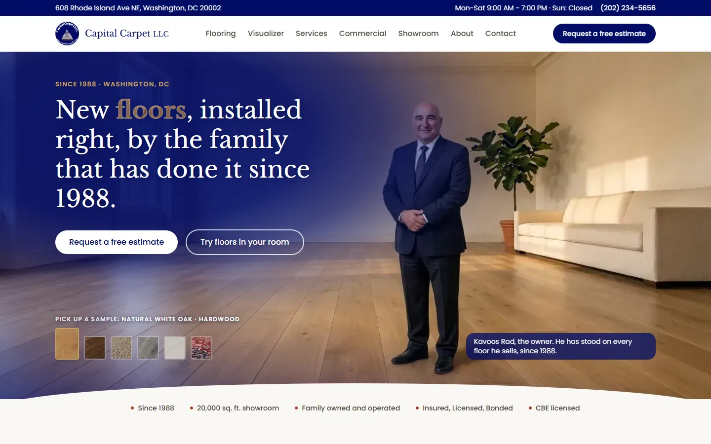 The Capital Carpet homepage with the owner standing in a room with a new wood floor